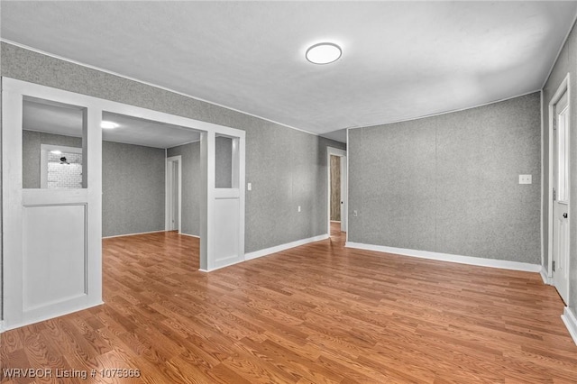 unfurnished room featuring wood-type flooring