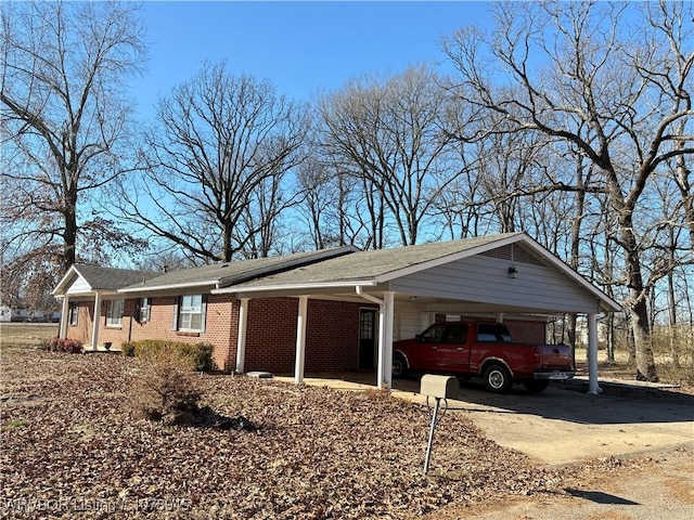 19 Lincoln Dr, Charleston, AR 72933 - view of front of home featuring brick siding, driveway, and a carport