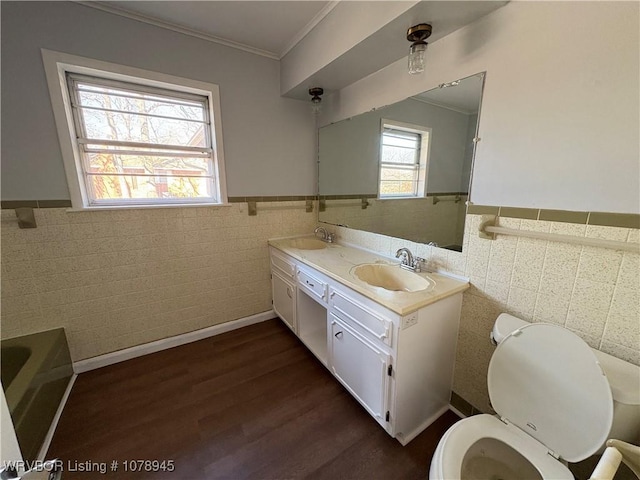 19 Lincoln Dr, Charleston, AR 72933 - bathroom featuring a sink, a wainscoted wall, toilet, and wood finished floors