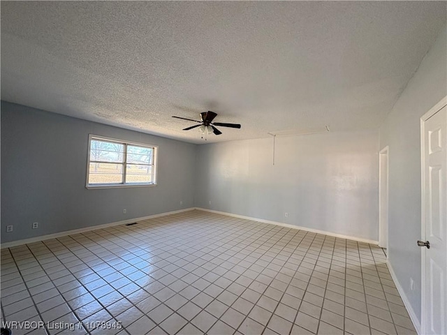 19 Lincoln Dr, Charleston, AR 72933 - empty room featuring light tile patterned floors, baseboards, a textured ceiling, and ceiling fan