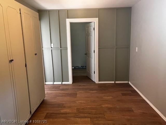 310 Butler St, Lavaca, AR 72941 - hall featuring dark wood-style floors and baseboards