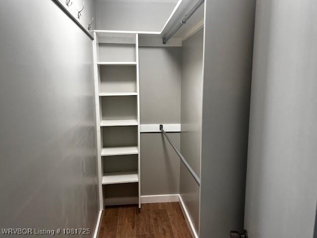 310 Butler St, Lavaca, AR 72941 - spacious closet featuring dark wood finished floors