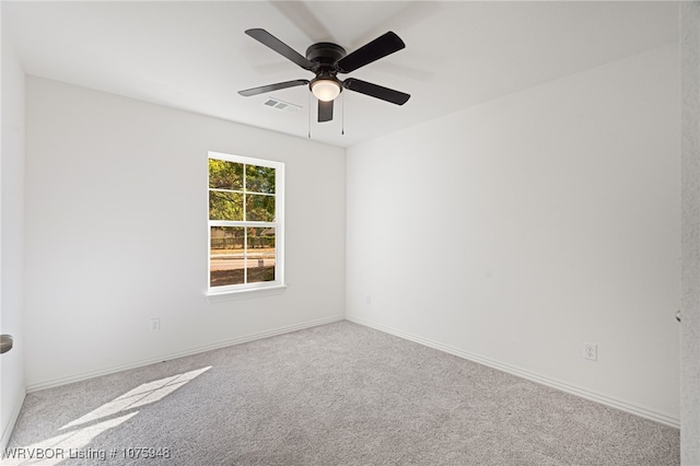 empty room with carpet floors and ceiling fan