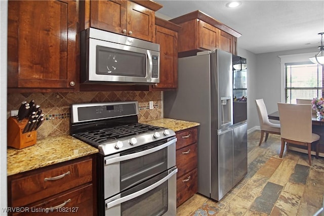 304 Rock Cir, Lavaca, AR 72941 - kitchen featuring stainless steel appliances, decorative backsplash, recessed lighting, light stone counters, and hanging light fixtures