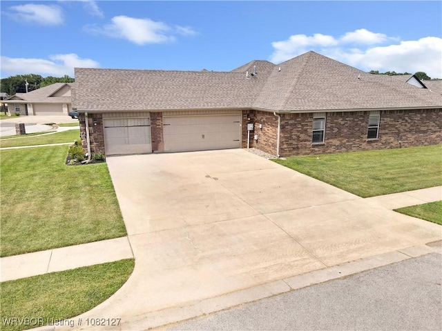 304 Rock Cir, Lavaca, AR 72941 - view of front of home featuring brick siding, roof with shingles, a garage, and a front lawn