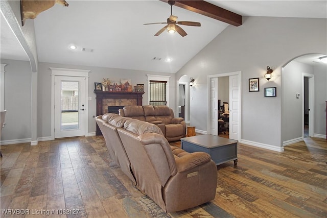 304 Rock Cir, Lavaca, AR 72941 - living area featuring ceiling fan, arched walkways, beam ceiling, dark wood-style floors, and a fireplace