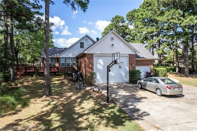 1635 Kings Way, Alma, AR 72921 - view of front of house featuring driveway, a garage, brick siding, and a wooden deck