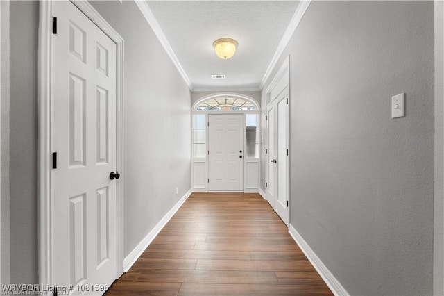 1635 Kings Way, Alma, AR 72921 - doorway featuring ornamental molding, dark wood finished floors, and baseboards