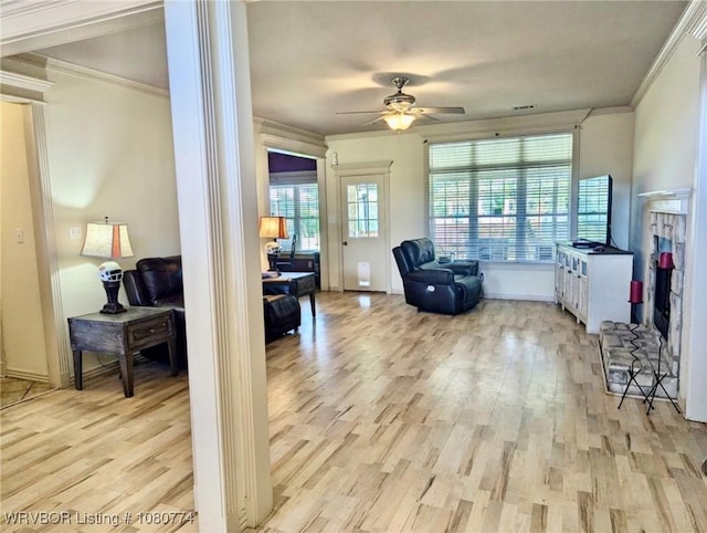108722 4768th Rd, Roland, OK 74954 - living area featuring ornamental molding, light wood finished floors, a ceiling fan, and decorative columns