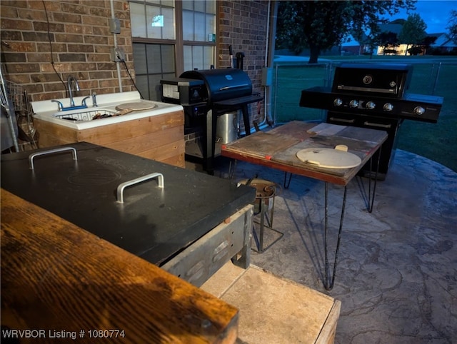 108722 4768th Rd, Roland, OK 74954 - view of patio / terrace with area for grilling, an outdoor bar, and an outdoor kitchen