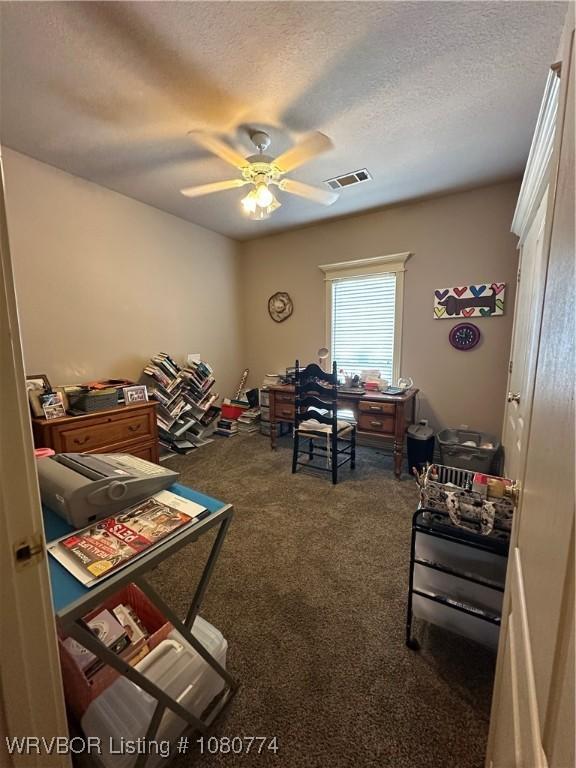 108722 4768th Rd, Roland, OK 74954 - bedroom with a textured ceiling, visible vents, ceiling fan, and carpet floors