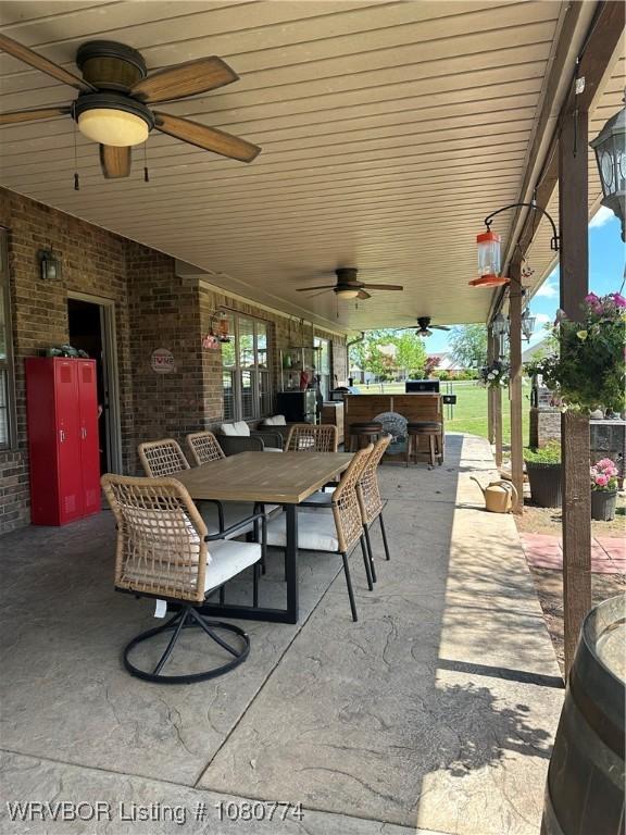 108722 4768th Rd, Roland, OK 74954 - view of patio with outdoor dining area, ceiling fan, and outdoor dry bar