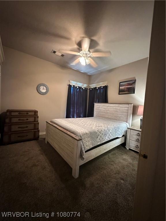 108722 4768th Rd, Roland, OK 74954 - bedroom featuring ceiling fan, carpet floors, baseboards, and visible vents