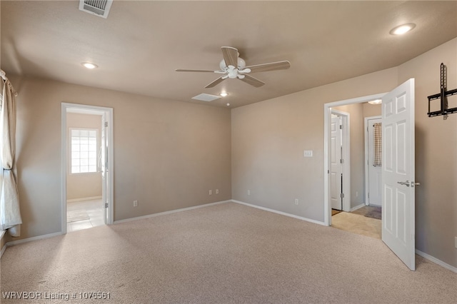 carpeted spare room with ceiling fan