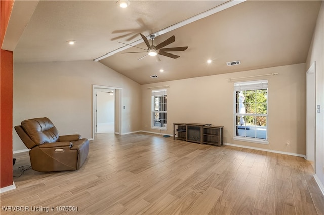 unfurnished room featuring vaulted ceiling with beams, ceiling fan, and light wood-type flooring