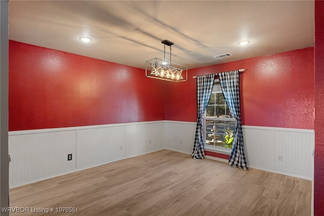 spare room with hardwood / wood-style flooring