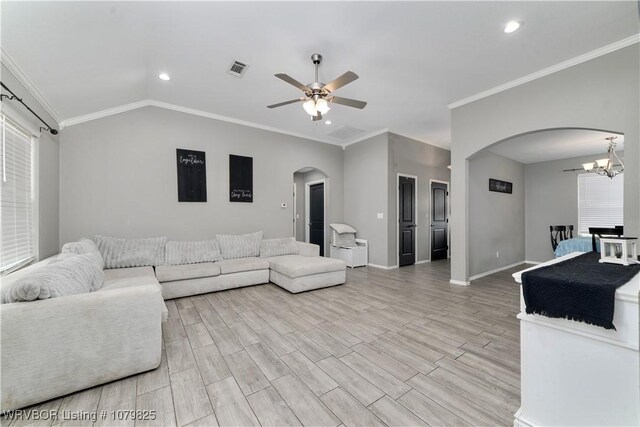 138 Stone Dr, Roland, OK 74954 - living area with arched walkways, lofted ceiling, wood tiled floor, and ceiling fan with notable chandelier