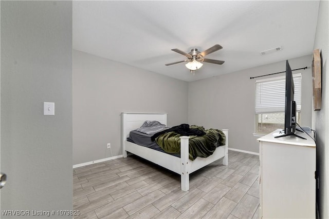 138 Stone Dr, Roland, OK 74954 - bedroom with baseboards, visible vents, and wood finish floors
