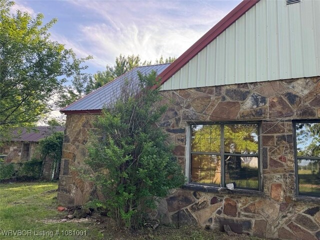 464085 E 1020th Rd, Sallisaw, OK 74955 - view of side of property featuring stone siding and metal roof