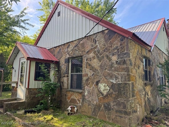 464085 E 1020th Rd, Sallisaw, OK 74955 - view of side of property featuring stone siding and metal roof
