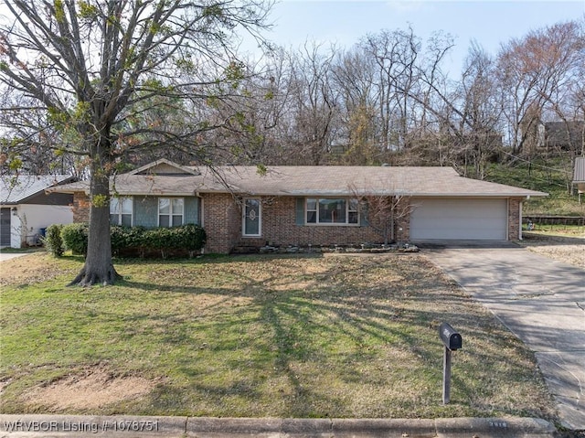 single story home with a garage and a front yard