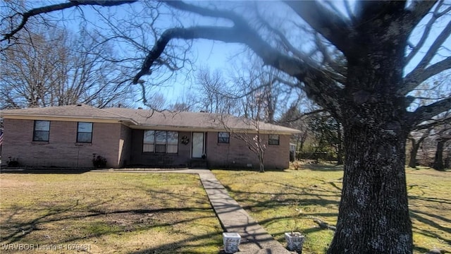 ranch-style house with a front lawn and brick siding