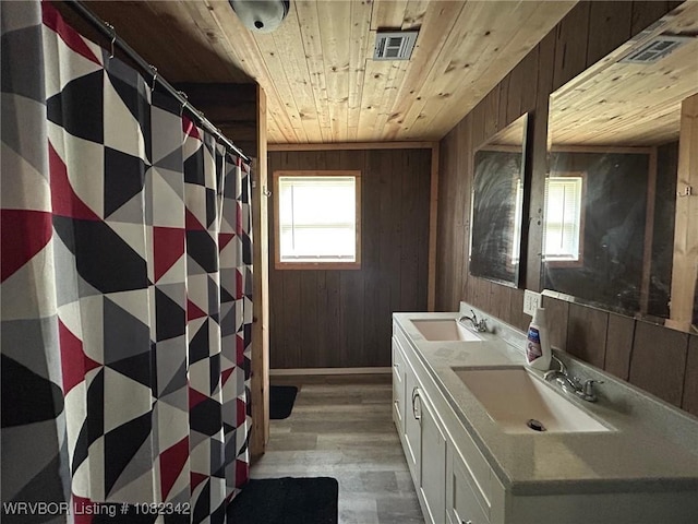 39668 S Barton, Fanshawe, OK 74935 - bathroom featuring wood ceiling, wood finished floors, wood walls, double vanity, and a shower with shower curtain