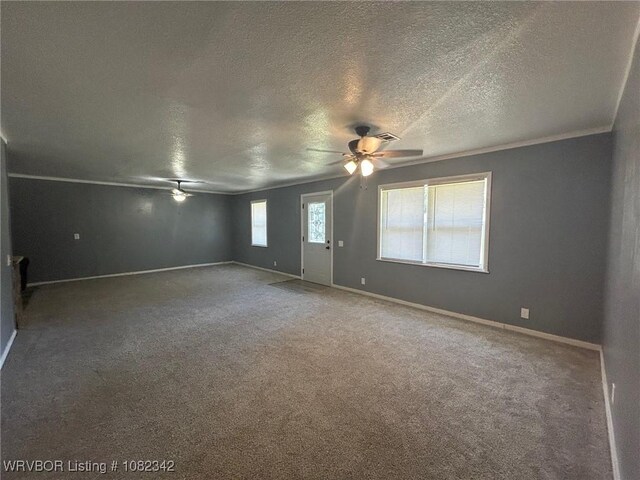 39668 S Barton, Fanshawe, OK 74935 - empty room featuring a ceiling fan, carpet floors, and a textured ceiling