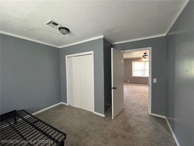 39668 S Barton, Fanshawe, OK 74935 - unfurnished bedroom featuring carpet flooring, a textured ceiling, and a closet