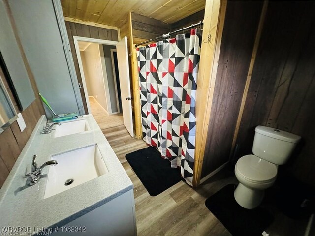 39668 S Barton, Fanshawe, OK 74935 - bathroom featuring wooden ceiling, wood finished floors, double vanity, a shower with shower curtain, and wood walls