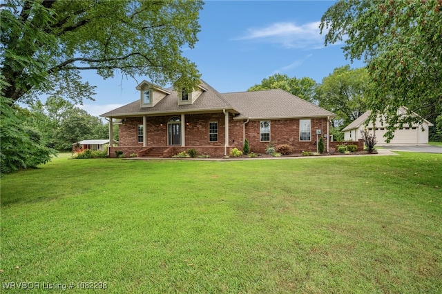 6721 Dean Rd, Alma, AR 72921 - view of front of house featuring a porch, brick siding, an outdoor structure, and a front lawn