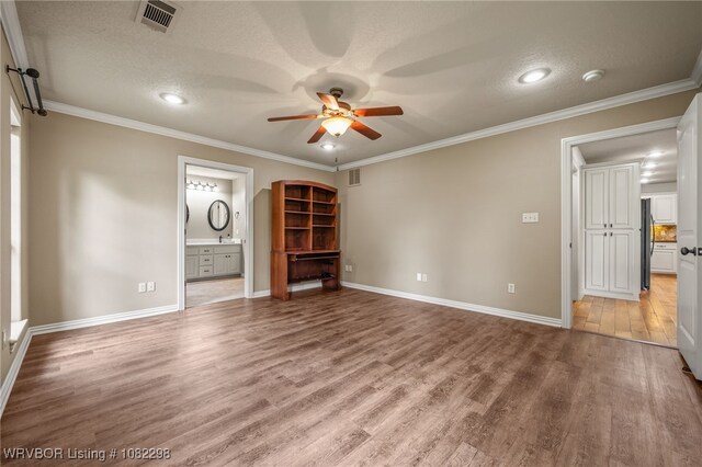 6721 Dean Rd, Alma, AR 72921 - spare room featuring ceiling fan, light wood-type flooring, a textured ceiling, ornamental molding, and recessed lighting