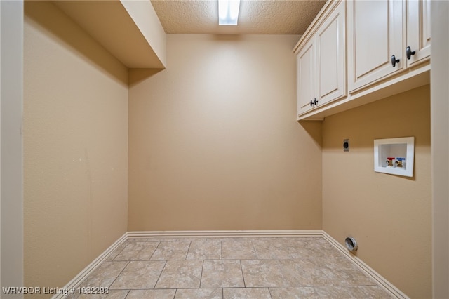 6721 Dean Rd, Alma, AR 72921 - laundry area with cabinet space, hookup for an electric dryer, washer hookup, and a textured ceiling