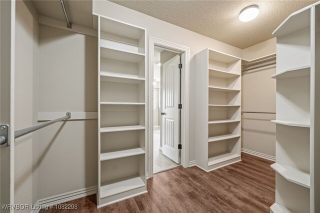 6721 Dean Rd, Alma, AR 72921 - walk in closet featuring wood finished floors