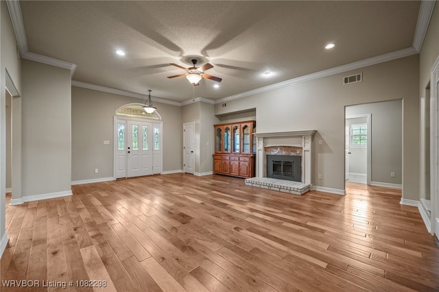 6721 Dean Rd, Alma, AR 72921 - unfurnished living room with a ceiling fan, light wood-type flooring, a brick fireplace, recessed lighting, and ornamental molding