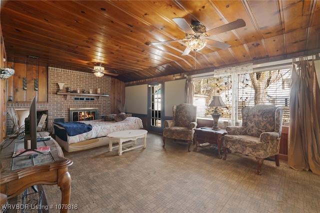 bedroom with wooden ceiling and a fireplace