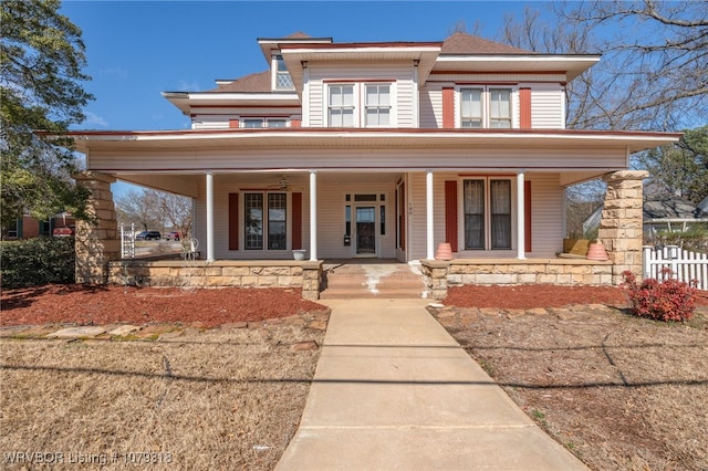 view of front of property with fence and a porch