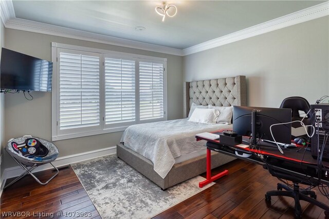 bedroom with dark wood-type flooring and ornamental molding