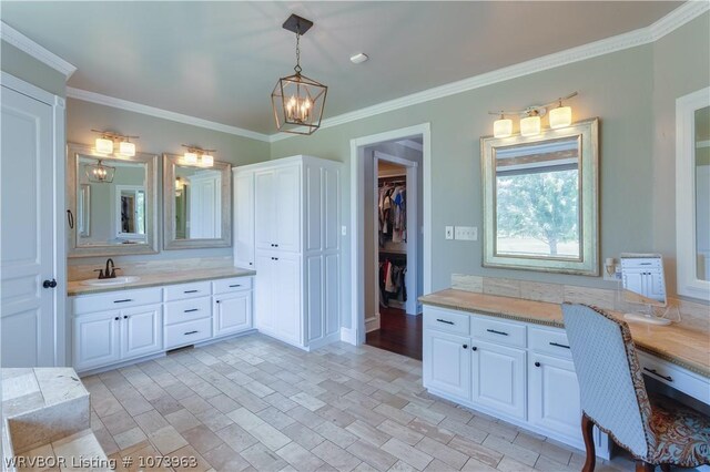 bathroom with vanity and crown molding