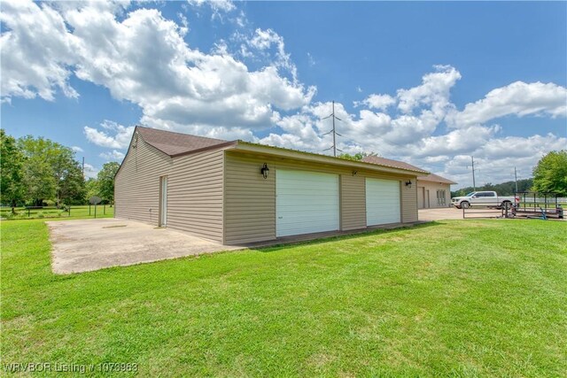 garage featuring a lawn