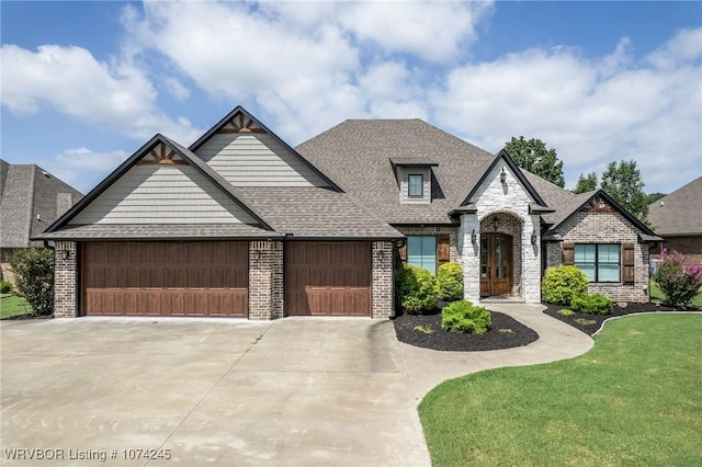 view of front facade featuring a front yard and a garage