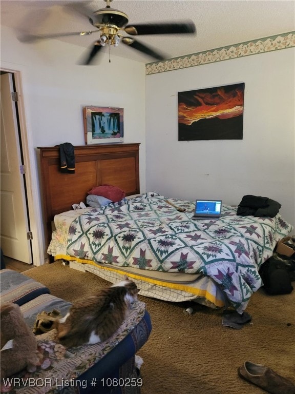 113614 S 4640th Rd, Gans, OK 74936 - bedroom featuring ceiling fan