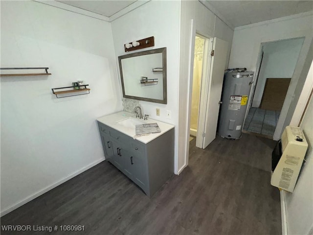 1221 S 3rd St, Stilwell, OK 74960 - bathroom with water heater, wood finished floors, baseboards, and vanity