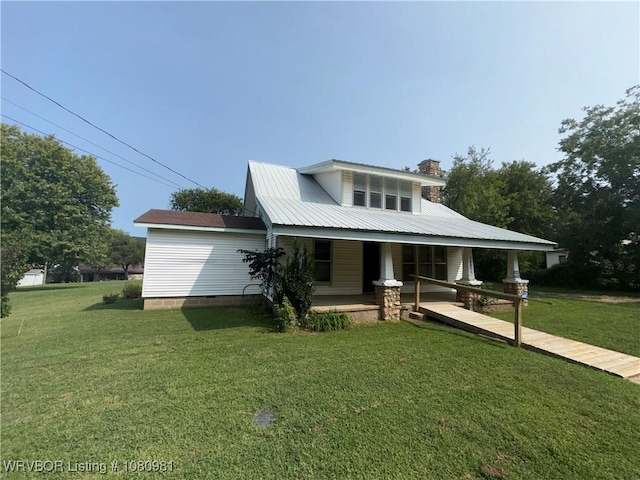 1221 S 3rd St, Stilwell, OK 74960 - view of front of property with covered porch, a front yard, and a chimney