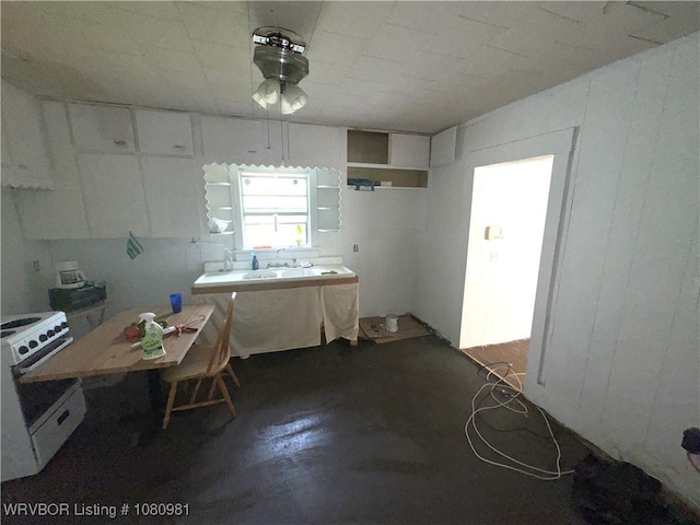 1221 S 3rd St, Stilwell, OK 74960 - kitchen featuring white range oven, a sink, and ceiling fan