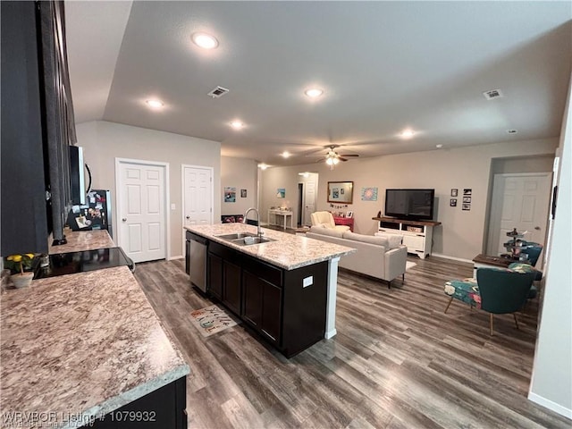 kitchen featuring visible vents, ceiling fan, a sink, and stainless steel appliances