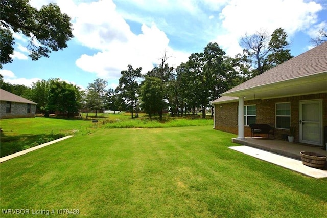 1111 Ridge Dr, Stilwell, OK 74960 - view of green lawn featuring a patio
