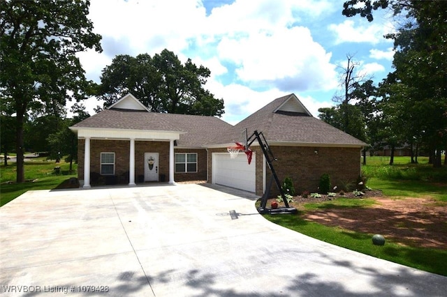 1111 Ridge Dr, Stilwell, OK 74960 - single story home with driveway, an attached garage, brick siding, and roof with shingles