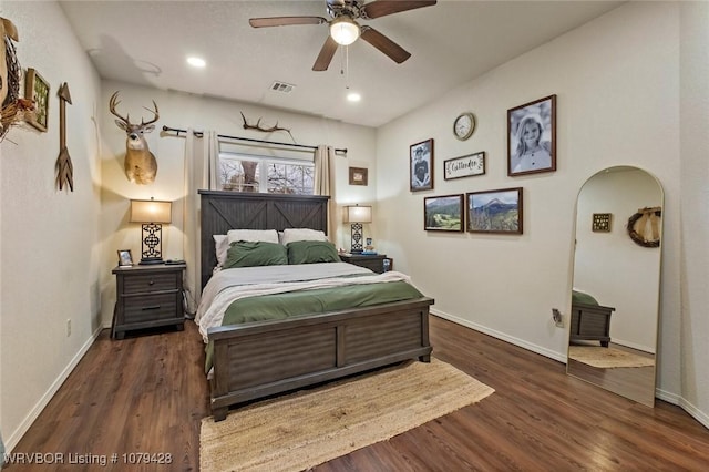 1111 Ridge Dr, Stilwell, OK 74960 - bedroom featuring baseboards, arched walkways, wood finished floors, recessed lighting, and ceiling fan