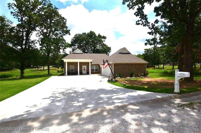 1111 Ridge Dr, Stilwell, OK 74960 - view of front of property featuring concrete driveway, a front lawn, brick siding, and an attached garage